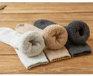Thick winter warm wool terry socks detail view, cozy mid-tube cold weather footwear for men.