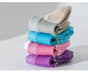 Detailed close-up of stacked colorful sports socks, breathable fabric and cushion sole.