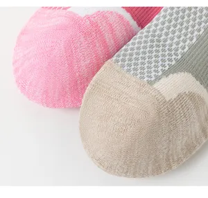 Breathable athletic socks detail shot featuring towel sole and mesh design for sports.