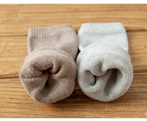Thickened terry knit leg warmers detail shot showing soft texture and cozy warmth.