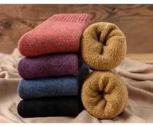 Closeup of thick warm winter thermal wool socks with cozy fleece lining inside for cold days.