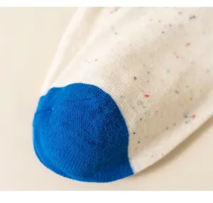 Close-up of colorful fleck knit cotton socks detail, soft texture design for daily comfort.