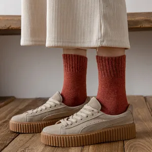 Comfortable women's winter thick wool mid-tube socks, warm fleece-lined thermal knit hosiery.