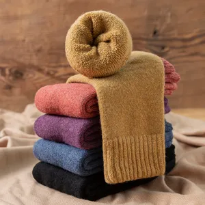 Women thick thermal wool socks winter warm mid-tube cozy fleece lined long cotton socks.