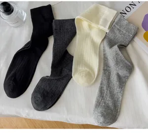 Solid color ribbed women socks, soft cotton blend comfortable casual mid tube socks.