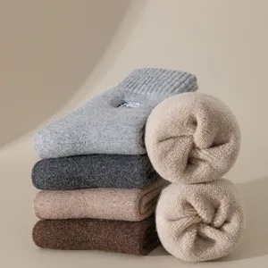 Men's thick wool winter thermal socks, cozy fleece lined mid-calf loop socks for cold days.