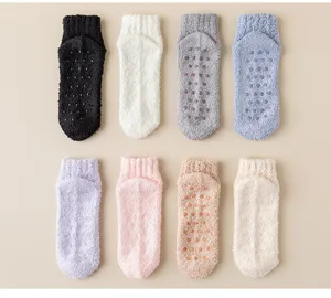 Thickened fuzzy coral fleece socks with anti-slip grip dots for warm winter home wear.