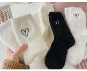 Cozy winter plush mink fleece slouch socks for women with cute heart embroidery details.