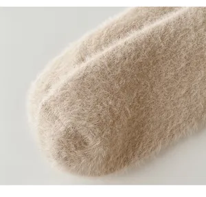 Close-up detail of soft fluffy winter plush warm sock fabric, showing cozy plush texture.