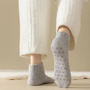 Women thick fuzzy winter socks with anti-slip grips, cozy coral fleece home socks.
