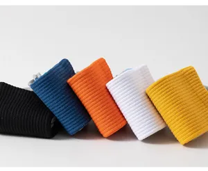 Close-up view of colorful ribbed cotton sports socks rolled neatly, soft and comfortable.