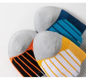 Close-up detail of color-blocked athletic basketball socks with breathable knit stripe design.