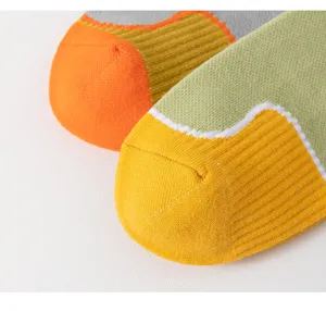 Colorful athletic crew socks detail showing breathable knit texture and reinforced toe design.