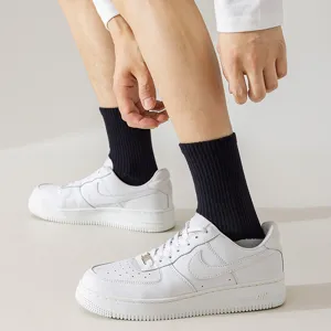 Comfortable black athletic mid-tube socks for men, breathable cotton casual crew socks.