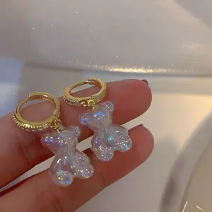Exquisite crystal bear drop earrings with sparkling diamond-inlaid gold hoops for women.