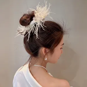 Elegant white ostrich feather hair scrunchie detail shot, chic Korean style fashion accessory.