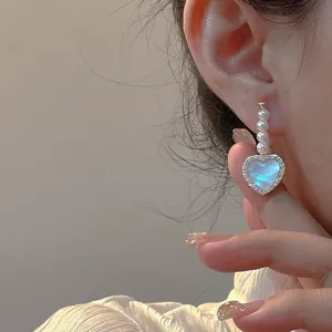 Korean style exquisite heart pearl earrings with sparkling diamond inlaid design for women.