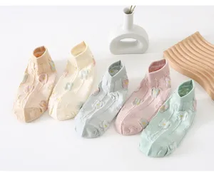 Detailed view of macaron colored women short socks featuring 3d floral pattern and neat design.