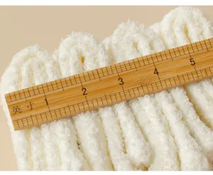 White fluffy coral fleece winter warm socks detail shot showcasing soft cozy texture.