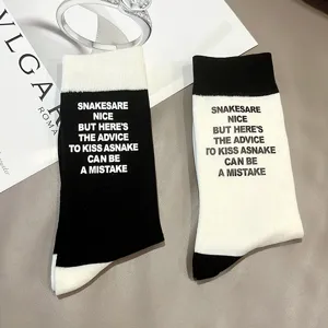 Trendy color-block letter printed cotton mid-tube socks for women, street style daily wear.