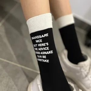 Black and white colorblock mid-calf socks with letter print for women streetwear.