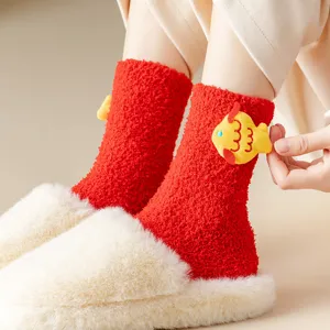 Red coral fleece thick winter socks for couples with cute fish decor mid tube main view.
