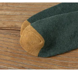 Men's winter thick terry cotton socks detail view, cozy athletic warm crew sock close-up.