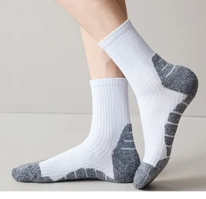 Close-up of men's athletic crew socks with thick cushioned towel bottom and ribbed cuff.