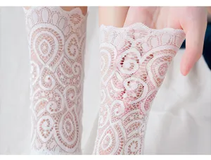 White Lolita lace socks detail close up, showing delicate hollow mesh floral stretch fabric.