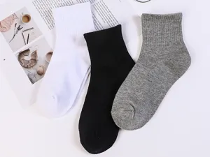 Chaussettes mi-hautes unies en coton pour hommes et femmes, chaussettes décontractées et respirantes.