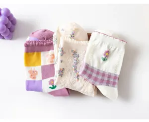 Detailed display of vintage floral knit mid-tube socks, soft pure cotton fabric.