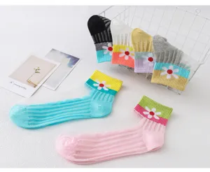 Close-up detail of sheer crystal socks featuring cute daisy flower pattern and breathable mesh.