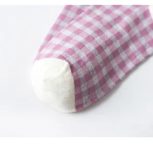 Detailed shot of purple vintage plaid women cotton socks showing soft fabric texture and toe.