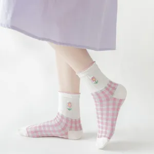 Women vintage pink gingham mid-tube socks with cute embroidered flower detail on feet.