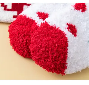 Plush Christmas socks detail view, soft coral fleece texture, warm and cozy winter sleep socks.