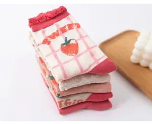Cute pink strawberry pattern mid-tube cotton socks detail view, sweet Japanese style.