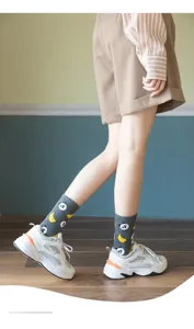 Cute cotton mid-tube socks with playful panda and banana print detail, stylish everyday wear.
