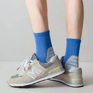 Men's mid-tube athletic sports socks with thick towel bottom and breathable ribbed design.