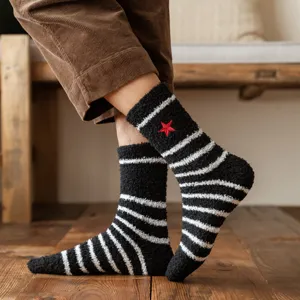 Cozy coral fleece winter socks with black white stripes and red star embroidery for men.