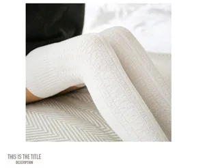Knit over-the-knee socks close-up view, cozy vintage ribbed wool long stockings for women.