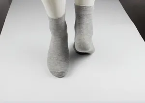 Plain grey cotton men crew socks detail view, comfortable breathable fabric for daily wear.