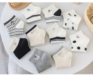 Details view of cute cartoon embroidered women socks with flecked yarn and striped cotton style.