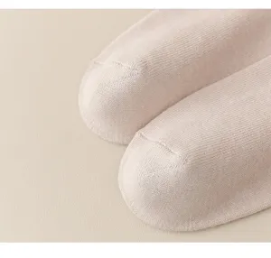 Close-up detail of solid color cotton calf socks, showing fine knit texture and neat toe seam.