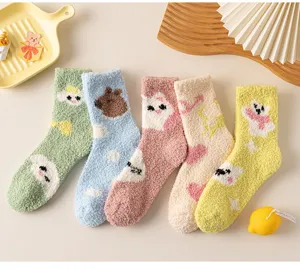 Detailed view of cozy cartoon plush winter socks with cute animal patterns for home wear.