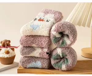 Cozy coral fleece plush socks detail view, showing thick warm winter home floor socks.