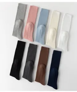 Detailed view of combed cotton ribbed solid color calf socks in multiple colors, neat flat lay.