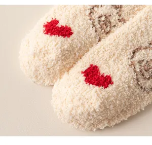 Plush cozy fleece socks detail shot, soft warm winter floor socks with cute heart design.
