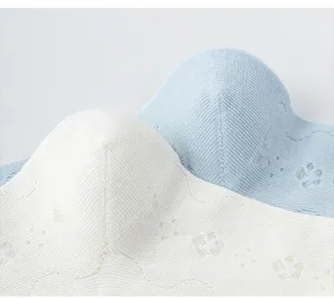 Detailed close-up of pure cotton women's knitted socks with delicate mesh and floral texture.