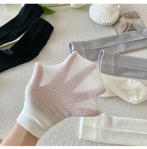 Detailed view of sheer long stockings showing elastic stretch texture and fine knit quality.