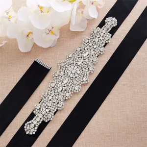 Rhinestone bridal belt detail showcasing sparkling crystal rhinestones and black satin ribbon.